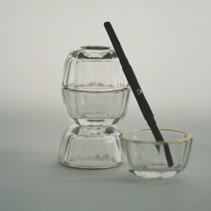 The Push Back cuticle pusher and nail cleaner in a glass bowl